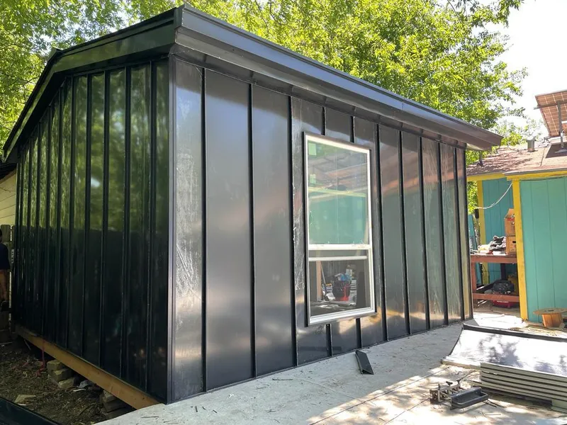 Black standing seam metal wall panels for Roof Inspection in Harrington Park