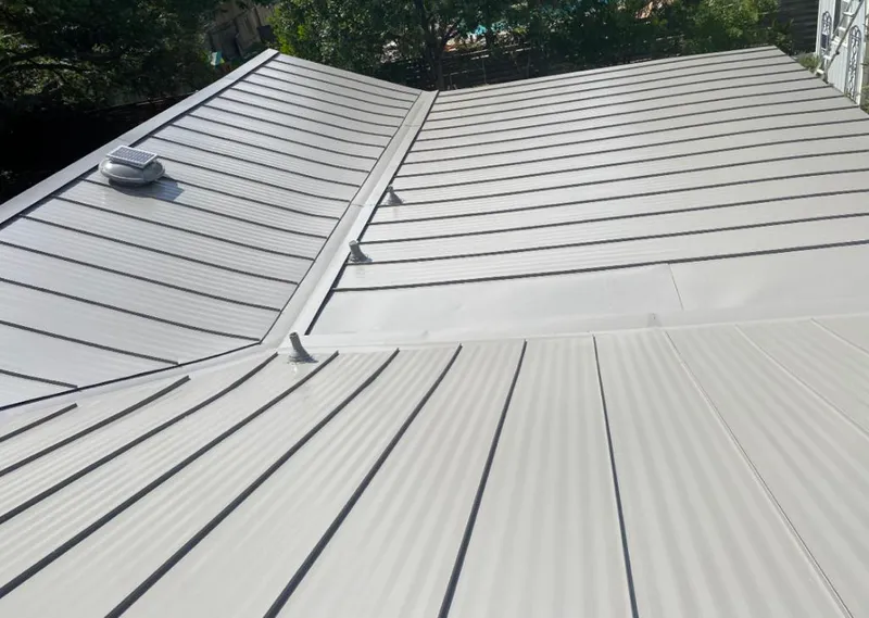 Solar attic fan installed on a metal roof for Roof Ventilation in Harrington Park